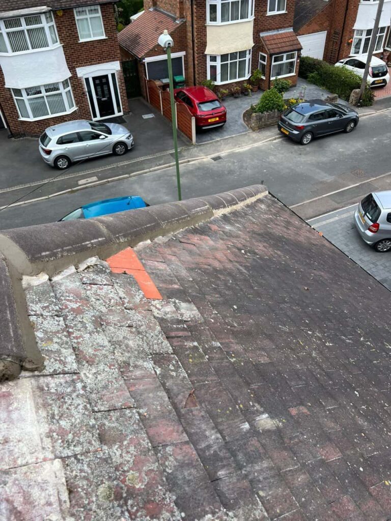 This is a photo of a hip roof where the bonnet tiles have just been replaced due to damage. Works carried out by Ruddington Roofing Repairs
