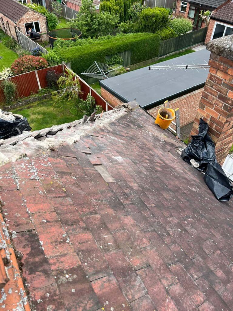 This is a photo of a roof where the hip tiles have been removed, and are just about to be replaced. Works carried out by Ruddington Roofing Repairs